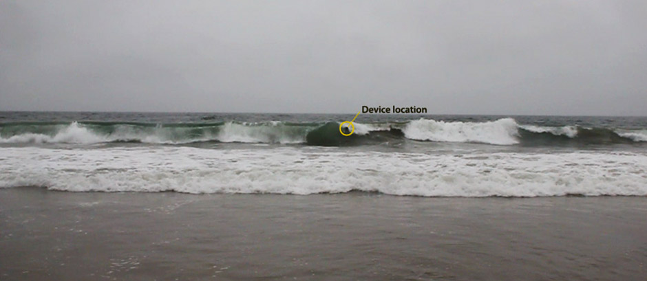 image of wave crashing with a measuring device floating over the crest of the wave